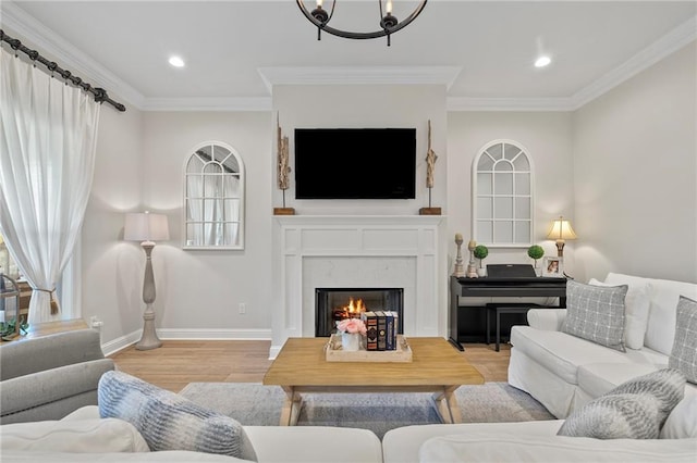 502 Terrace Lake Dr, Covington, LA 70435 - living area featuring wood finished floors, a premium fireplace, ornamental molding, a chandelier, and recessed lighting