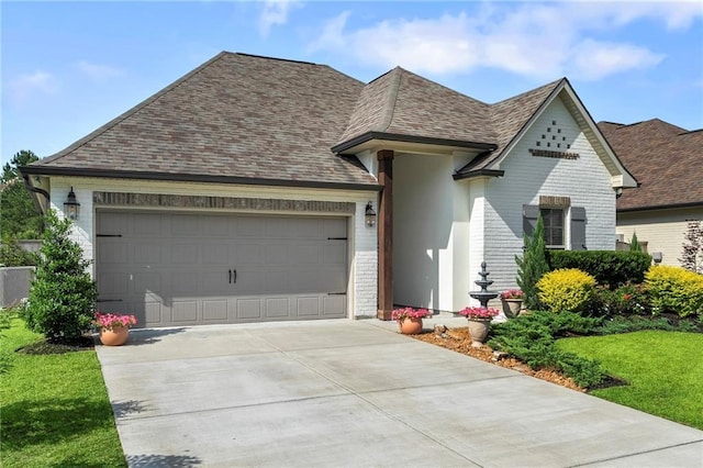 502 Terrace Lake Dr, Covington, LA 70435 - view of front of property featuring brick siding, a garage, concrete driveway, a shingled roof, and a front yard