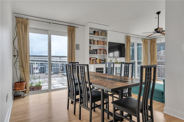 920 Poeyfarre St Unit Ph18, New Orleans, LA 70130 - dining room with ceiling fan and wood finished floors