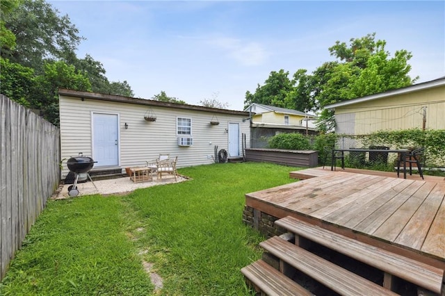 2018 Adams St, New Orleans, LA 70118 - rear view of property featuring a fenced backyard and a wooden deck