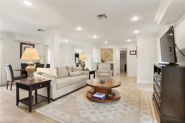 2521 Metairie Lawn Dr Unit 214, Metairie, LA 70002 - living area featuring ornamental molding, recessed lighting, and decorative columns