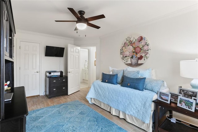 2521 Metairie Lawn Dr Unit 214, Metairie, LA 70002 - bedroom with crown molding, wood finished floors, ensuite bath, and ceiling fan