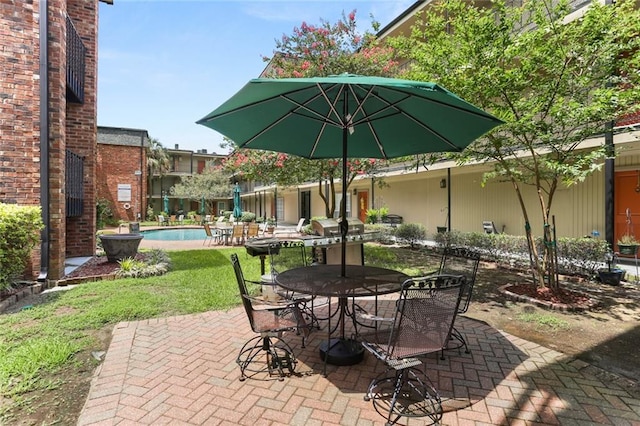 2521 Metairie Lawn Dr Unit 214, Metairie, LA 70002 - view of patio / terrace with an outdoor pool and outdoor dining area