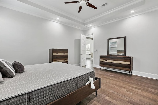 5502 Wilton Dr, New Orleans, LA 70122 - bedroom with recessed lighting, ornamental molding, wood finished floors, a tray ceiling, and ceiling fan