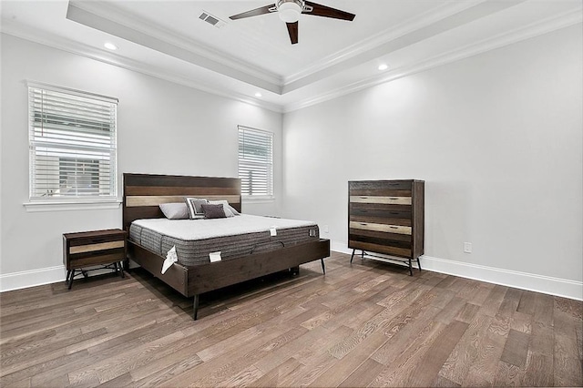 5502 Wilton Dr, New Orleans, LA 70122 - bedroom featuring a tray ceiling, wood finished floors, ornamental molding, recessed lighting, and a ceiling fan