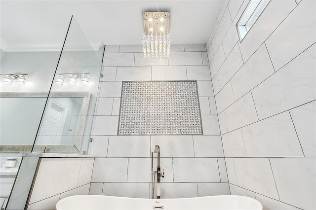 5502 Wilton Dr, New Orleans, LA 70122 - bathroom featuring a soaking tub, crown molding, a chandelier, tile walls, and a tile shower