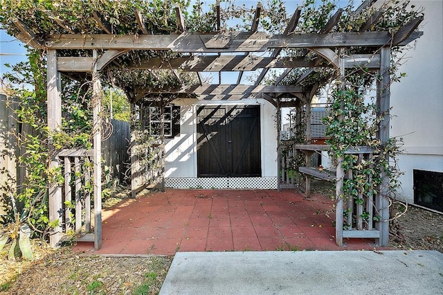 5502 Wilton Dr, New Orleans, LA 70122 - view of patio featuring a storage shed and a pergola