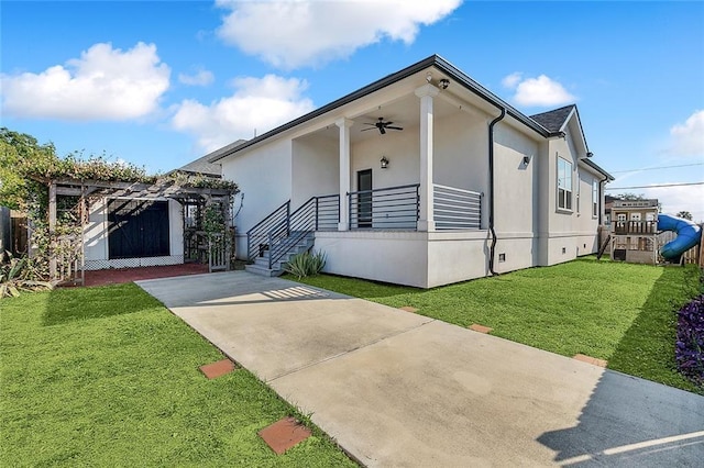 5502 Wilton Dr, New Orleans, LA 70122 - view of front of home with a front yard, ceiling fan, stucco siding, a pergola, and covered porch
