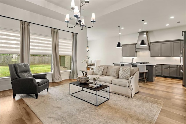 4028 Cypress Point Dr, Covington, LA 70433 - living room with a chandelier, light wood-type flooring, and recessed lighting