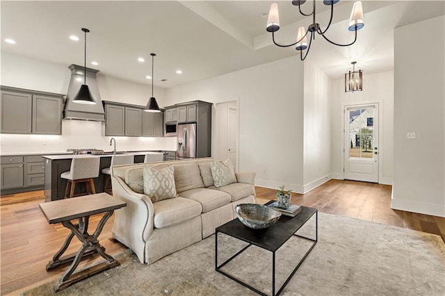 4028 Cypress Point Dr, Covington, LA 70433 - living room with a chandelier, light wood-style flooring, and recessed lighting