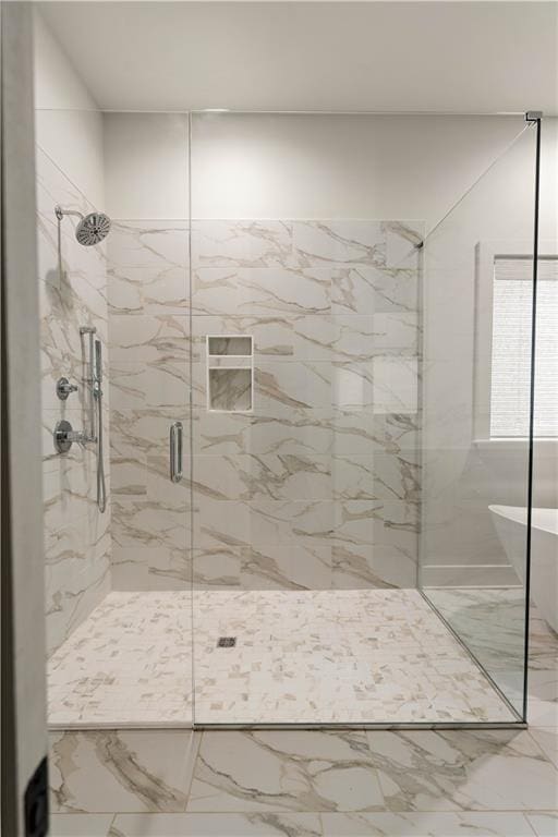 4028 Cypress Point Dr, Covington, LA 70433 - bathroom featuring a marble finish shower, a freestanding tub, and marble finish floors