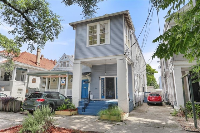 4149-51 Canal St, New Orleans, LA 70119 - view of front of house featuring concrete driveway and covered porch