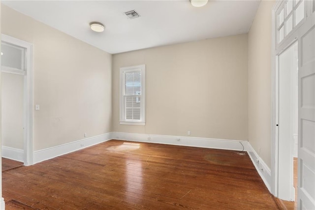 4149-51 Canal St, New Orleans, LA 70119 - unfurnished bedroom featuring hardwood / wood-style floors and baseboards