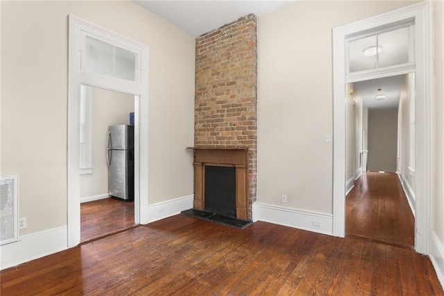 4149-51 Canal St, New Orleans, LA 70119 - unfurnished living room featuring hardwood / wood-style flooring and a fireplace