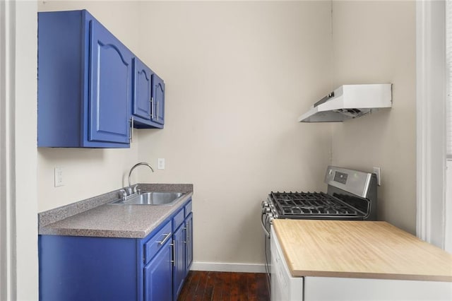 4149-51 Canal St, New Orleans, LA 70119 - kitchen featuring custom range hood, gas range, blue cabinetry, and dark wood-style flooring