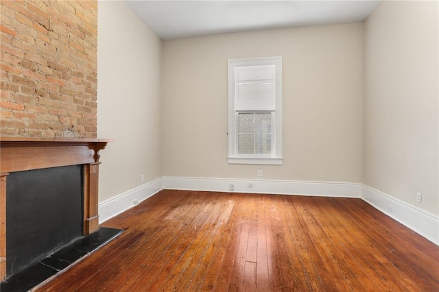 4149-51 Canal St, New Orleans, LA 70119 - unfurnished living room featuring hardwood / wood-style flooring and a fireplace