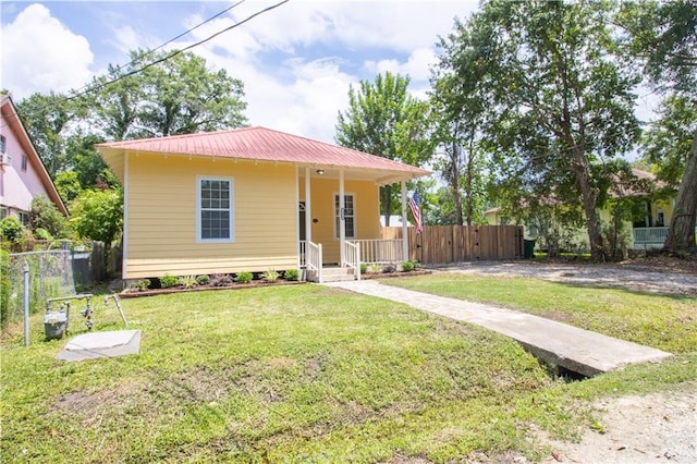 2970 College St, Slidell, LA 70458 - view of front of property featuring a metal roof and a porch