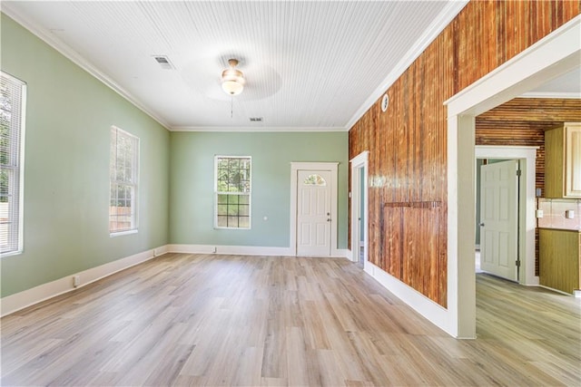 2970 College St, Slidell, LA 70458 - spare room with ornamental molding, a ceiling fan, and light wood-style flooring