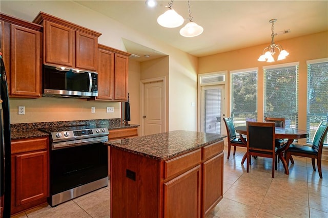 626 Bellingrath Ln, Slidell, LA 70458 - kitchen featuring stainless steel appliances, a chandelier, dark stone counters, and decorative light fixtures