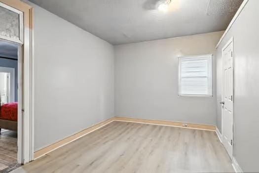 1635 Frenchmen St, New Orleans, LA 70116 - unfurnished bedroom with wood finished floors