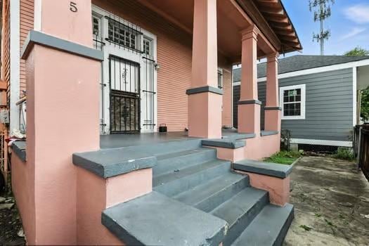 1635 Frenchmen St, New Orleans, LA 70116 - doorway to property with a porch