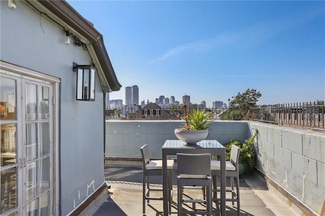 1303 Burgundy St Unit 14, New Orleans, LA 70116 - balcony with a skyline view and outdoor dining area