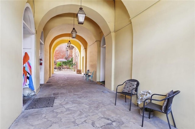 1303 Burgundy St Unit 14, New Orleans, LA 70116 - property entrance with stucco siding and a patio