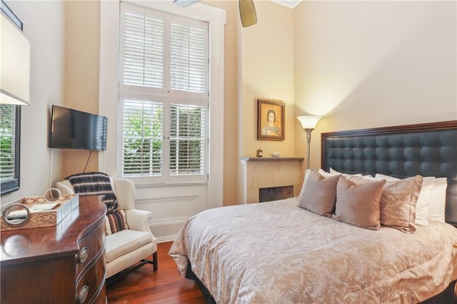 740 Esplanade Ave Unit 3, New Orleans, LA 70116 - bedroom with dark wood-style floors and multiple windows