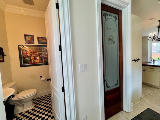 712 Stewart Ave, River Ridge, LA 70123 - bathroom featuring crown molding, a chandelier, and vanity