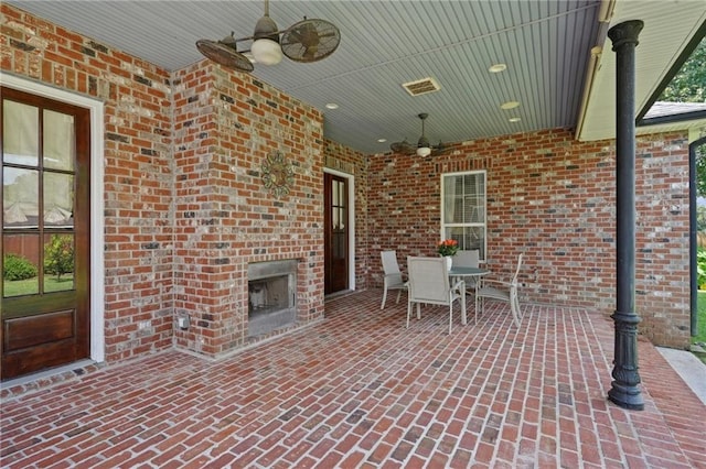 712 Stewart Ave, River Ridge, LA 70123 - view of patio / terrace with a ceiling fan, an outdoor brick fireplace, and outdoor dining area