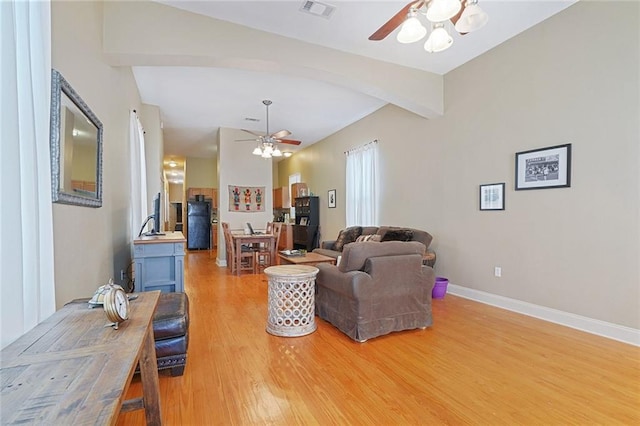 215 N Rendon St, New Orleans, LA 70119 - living area with ceiling fan, light wood-type flooring, and beamed ceiling