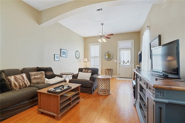 215 N Rendon St, New Orleans, LA 70119 - living area featuring arched walkways, light wood finished floors, and a ceiling fan
