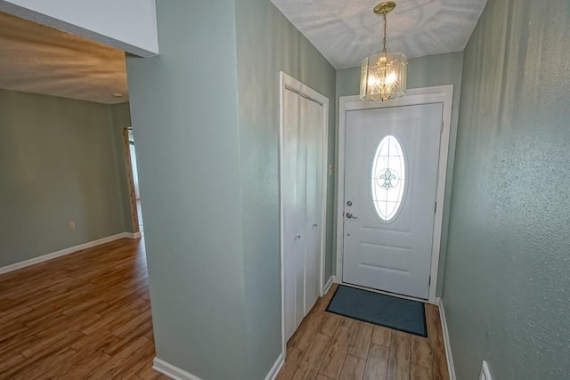 42 Hennessey Ct, River Ridge, LA 70123 - foyer with wood finished floors and a chandelier