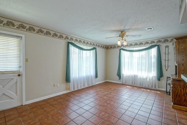 42 Hennessey Ct, River Ridge, LA 70123 - spare room featuring plenty of natural light, tile patterned floors, ceiling fan, and a textured ceiling