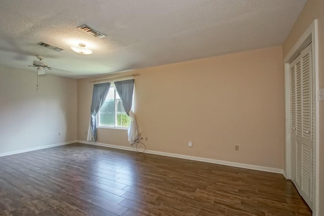 42 Hennessey Ct, River Ridge, LA 70123 - unfurnished bedroom featuring dark wood-style floors, a textured ceiling, and a closet