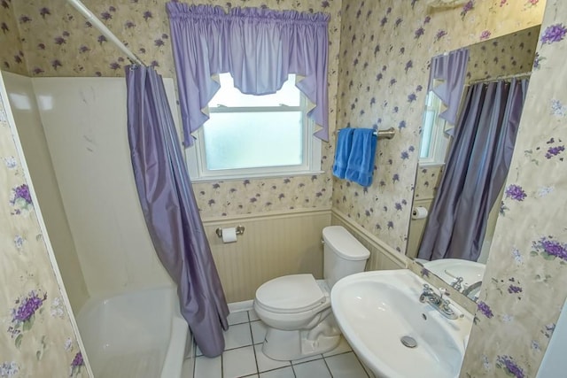 42 Hennessey Ct, River Ridge, LA 70123 - full bathroom with wallpapered walls, wainscoting, shower / bathtub combination with curtain, and tile patterned floors