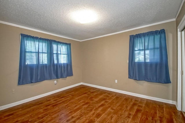 42 Hennessey Ct, River Ridge, LA 70123 - empty room featuring a textured ceiling, wood finished floors, and ornamental molding