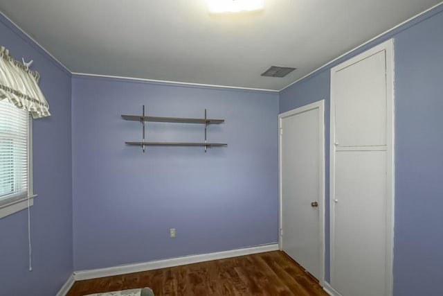 42 Hennessey Ct, River Ridge, LA 70123 - empty room featuring dark wood finished floors and crown molding