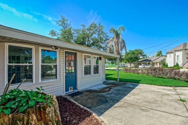 42 Hennessey Ct, River Ridge, LA 70123 - entrance to property with a lawn and a patio area