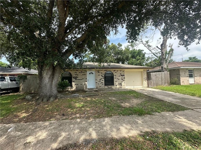 2012 S Sugar Ridge Rd, La Place, LA 70068 - view of front of house with driveway, brick siding, and an attached garage