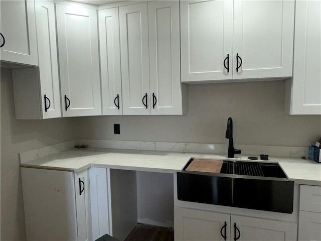 2012 S Sugar Ridge Rd, La Place, LA 70068 - kitchen featuring white cabinetry and light stone counters