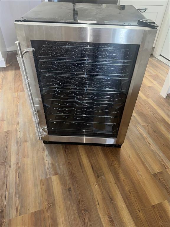 2012 S Sugar Ridge Rd, La Place, LA 70068 - kitchen view of wood finished floors and beverage cooler