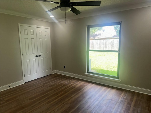 2012 S Sugar Ridge Rd, La Place, LA 70068 - unfurnished bedroom with dark wood-style floors, crown molding, a textured ceiling, a closet, and ceiling fan