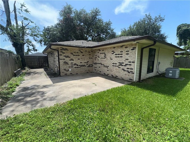 2012 S Sugar Ridge Rd, La Place, LA 70068 - view of side of property featuring a fenced backyard, a patio area, and brick siding