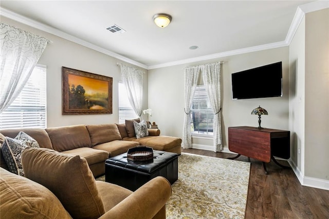 931 French St, New Orleans, LA 70124 - living area featuring plenty of natural light, ornamental molding, and dark wood finished floors