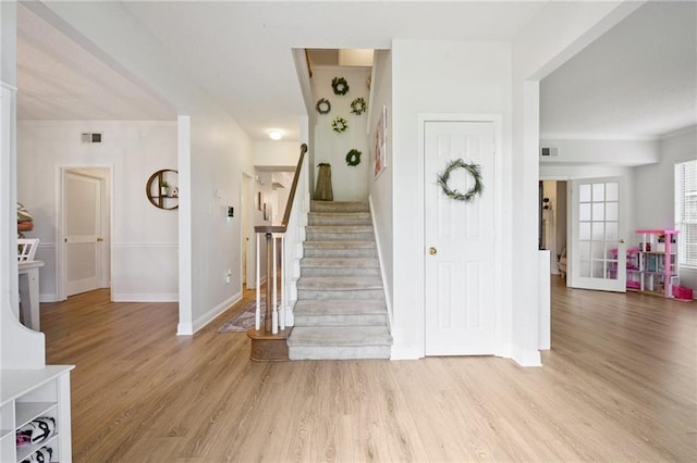 1125 Lori Dr, Slidell, LA 70461 - stairs featuring baseboards and wood finished floors