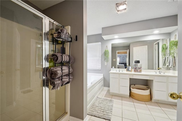 1125 Lori Dr, Slidell, LA 70461 - full bath with a shower stall, vanity, tile patterned floors, a garden tub, and healthy amount of natural light