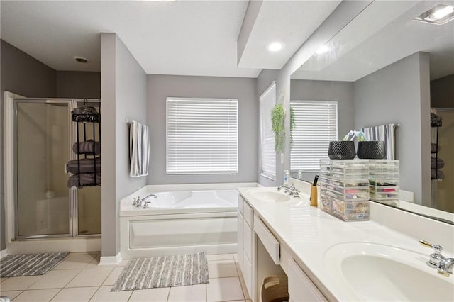 1125 Lori Dr, Slidell, LA 70461 - bathroom featuring a shower stall, a bath, tile patterned flooring, and double vanity
