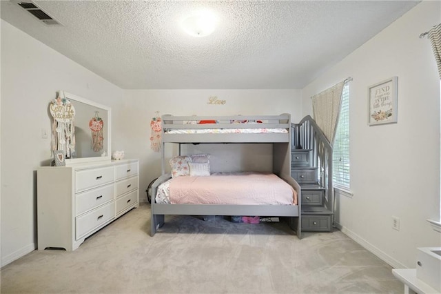 1125 Lori Dr, Slidell, LA 70461 - bedroom with light carpet and a textured ceiling