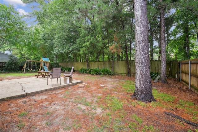1125 Lori Dr, Slidell, LA 70461 - fenced backyard with a playground